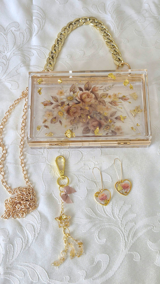 תיק אקרילי ייחודי בעיצוב פרחוני שקוף Golden Blossom